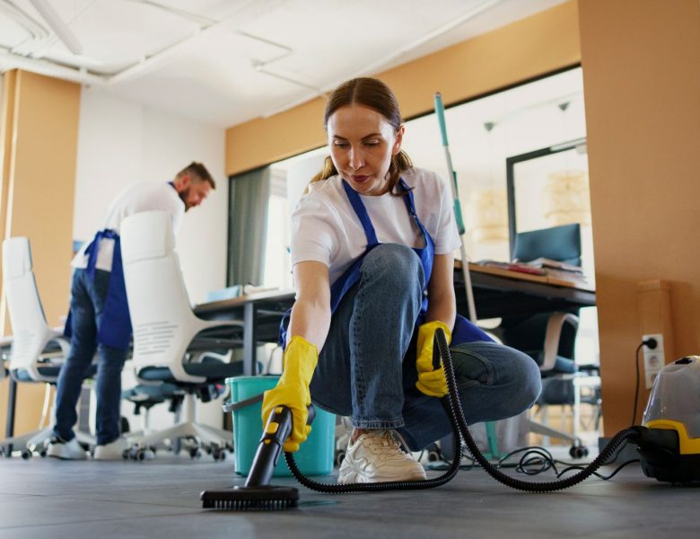 professional-cleaning-service-person-using-vacuum-cleaner-office-1